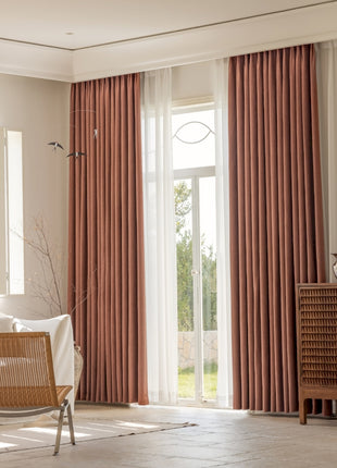 a living room filled with furniture and a large window