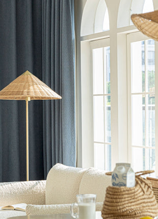 a living room filled with furniture and a large window