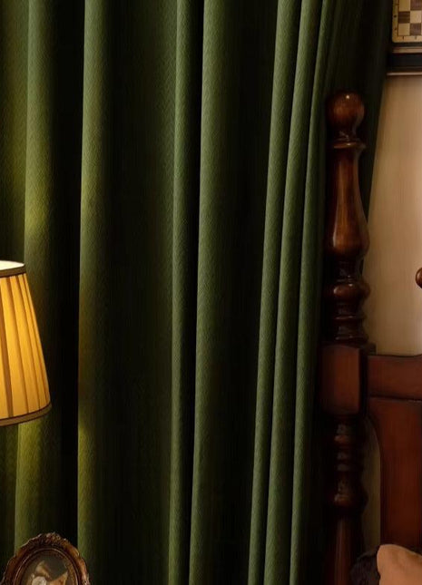 a lamp sitting on top of a table next to a bed