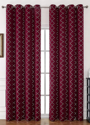 a living room with a window covered in red curtains