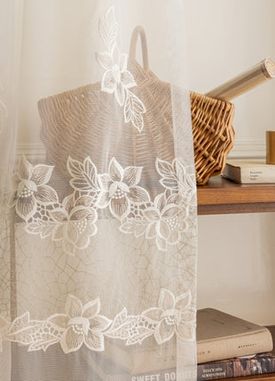 a shelf with a basket, a basket, and a curtain