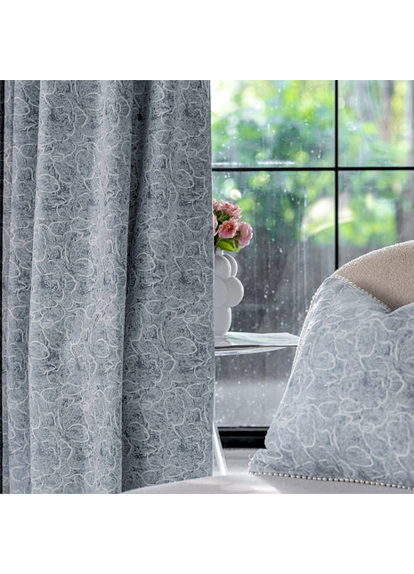a white chair sitting in front of a window