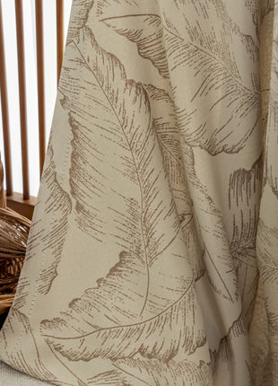 a basket sitting on top of a table next to a curtain