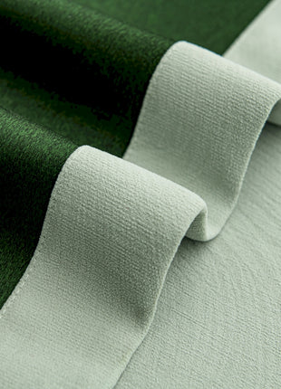 a close up of a green and white fabric