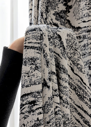 a person holding a piece of cloth in their hand