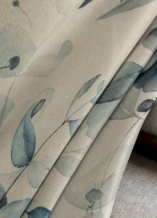 a close up of a fabric with blue flowers on it