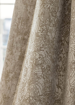 a close up of a curtain with a window in the background