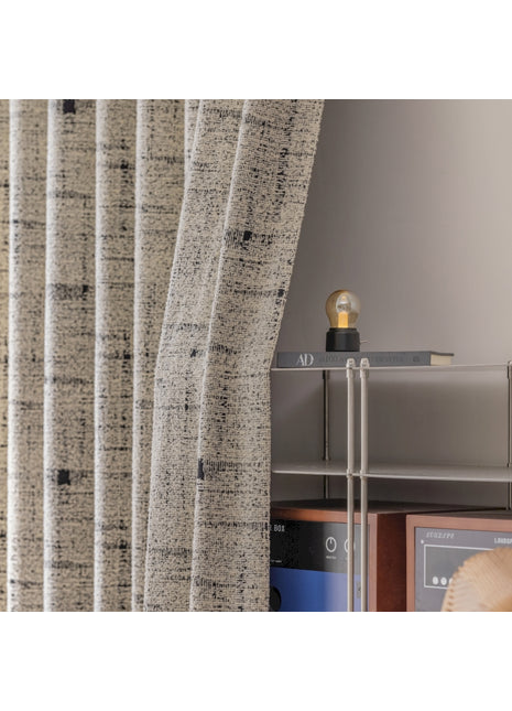 a room with a shelf and a window with a curtain