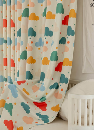 a white crib next to a window with a curtain