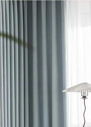 a living room filled with furniture and a lamp