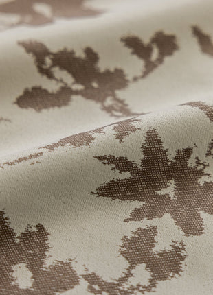 a close up of a fabric with a flower pattern