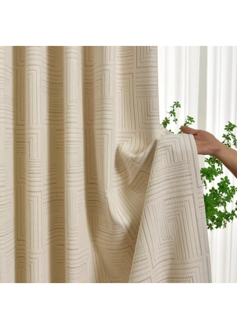 a person holding a curtain with a plant in the background