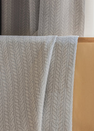 a chair with a blanket on top of it