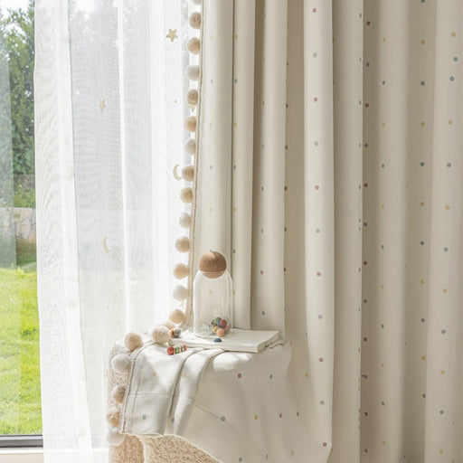 a white chair sitting in front of a window