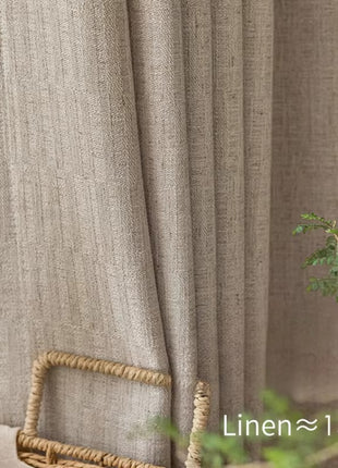 a wicker basket sitting next to a window