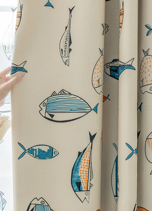 a woman is looking out a window with fish on it