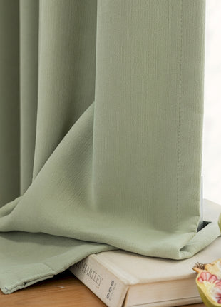 an apple and a book on a table