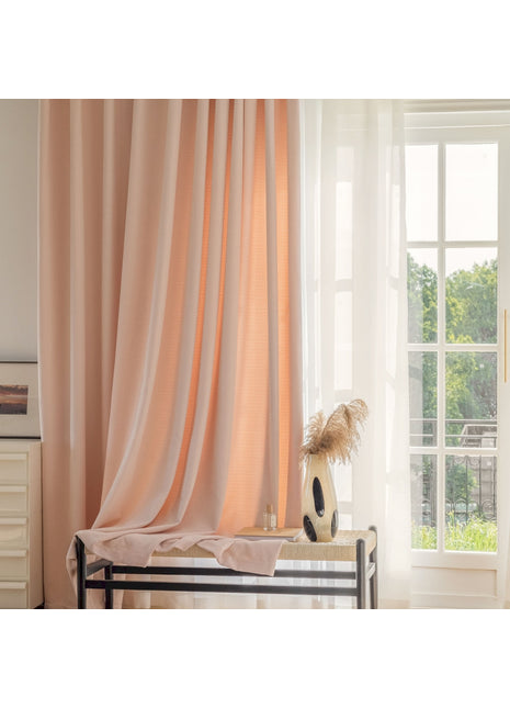 a room with a bed, a window, and a vase