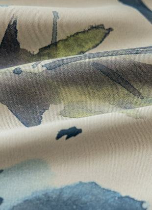 a close up of a fabric with leaves on it