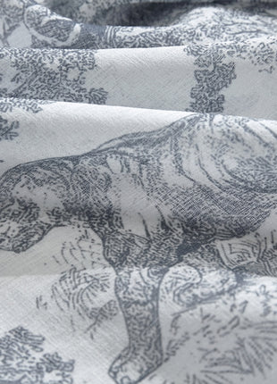 a close up of a fabric with animals on it