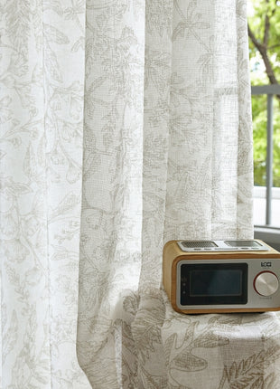 a small clock sitting on top of a table next to a window