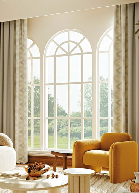 a living room filled with furniture and a large window