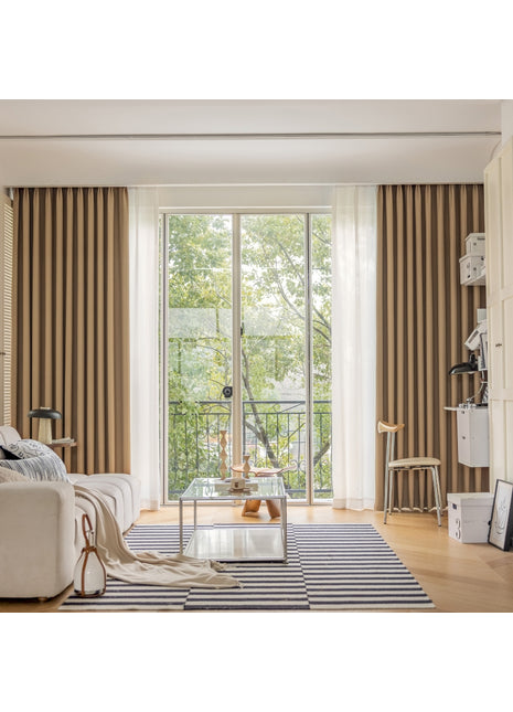 a living room filled with furniture and a large window