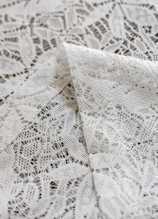 a close up of a white lace fabric