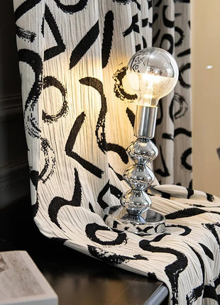 a black and white chair with a light on it