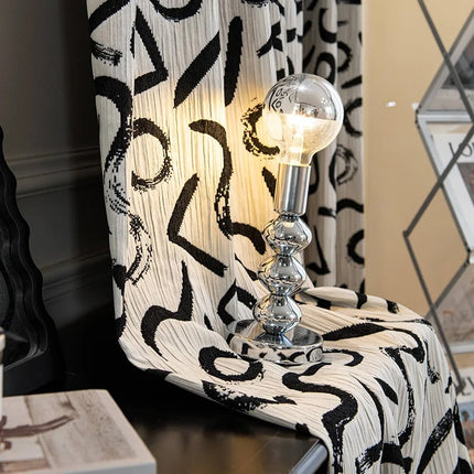 a black and white chair with a light on it