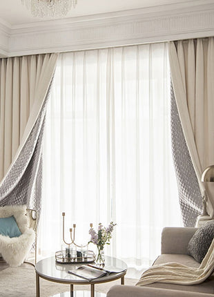 a living room filled with furniture and a chandelier