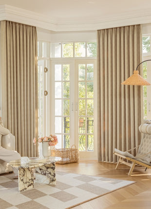 a woman sitting on a couch in a living room