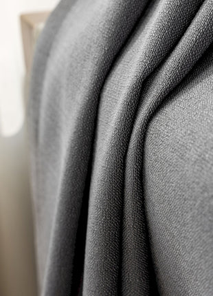 a close up of a bed with a blanket on top of it