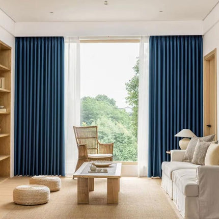 a living room filled with furniture and a large window