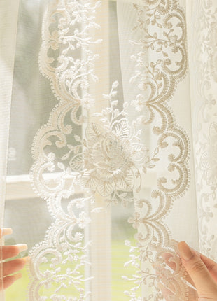 two hands are reaching out from behind a curtain