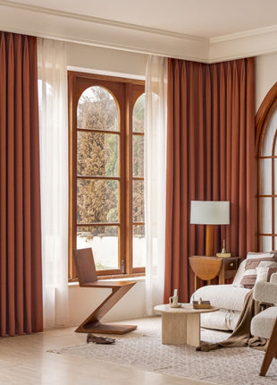 a living room filled with furniture and a large window