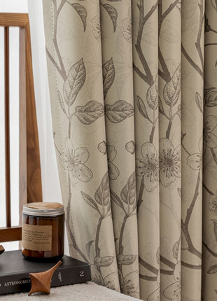 a jar of honey sitting on top of a book next to a window