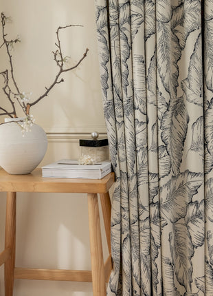 a white vase sitting on top of a wooden table