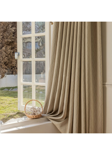 a window with a curtain and a basket on the window sill