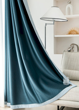 a cat laying on a couch in a living room