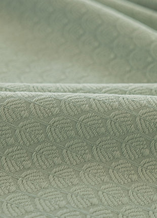 a close up shot of a green fabric
