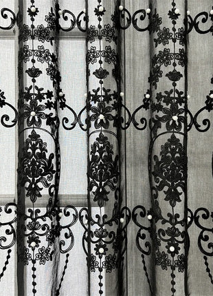 a black and white photo of a curtain