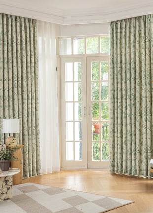 a living room filled with furniture and a large window