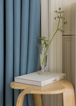 a vase of flowers sitting on top of a book