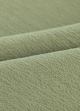 a close up view of a green fabric
