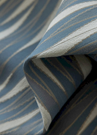 a close up of a blue and white striped fabric