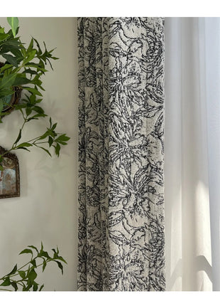 a plant is hanging on a wall next to a window