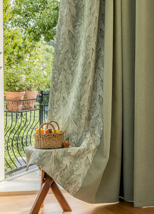 a basket of fruit sitting on a table in front of a window