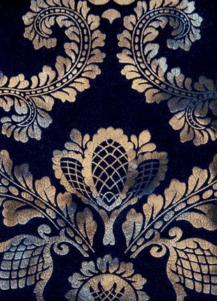 a close up of a black and gold wallpaper