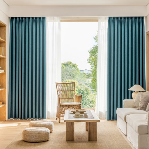 a living room filled with furniture and a large window